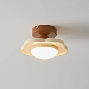 Laguna ceiling lamp with integrated warm LED light, cozy Nordic-inspired ambient lighting on gray wall background