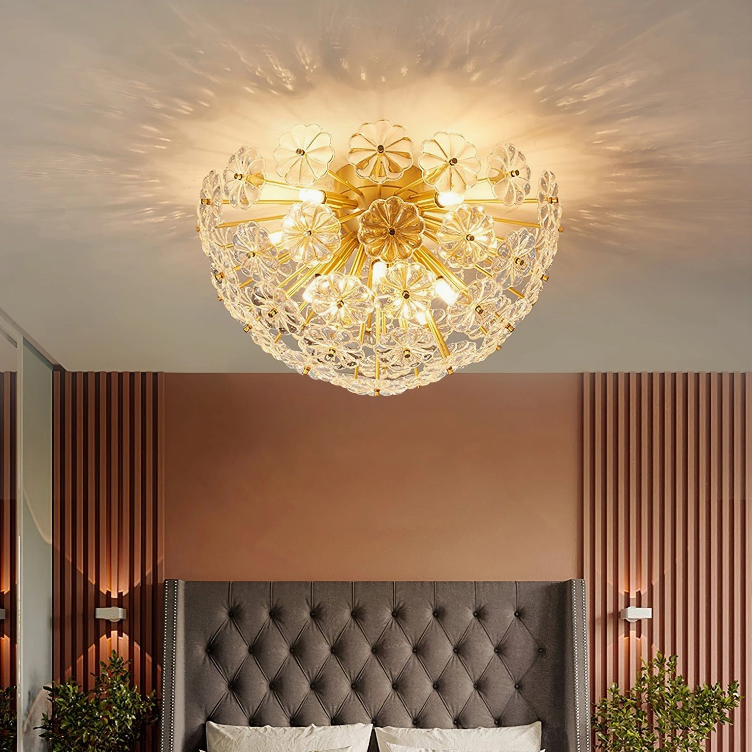Lamina brass ceiling light with clear glass reflecting light in botanical blossom pattern