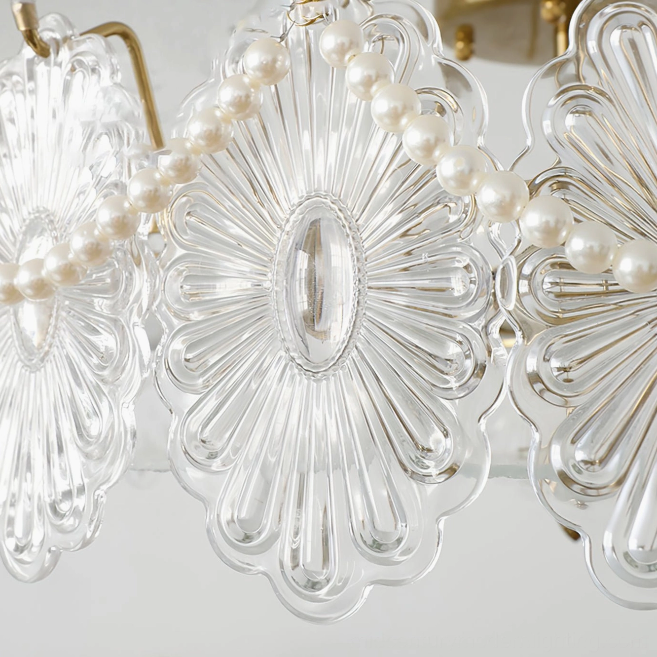 Close-up detail of Lamina lamp carved glass petals and faux pearl chain trim