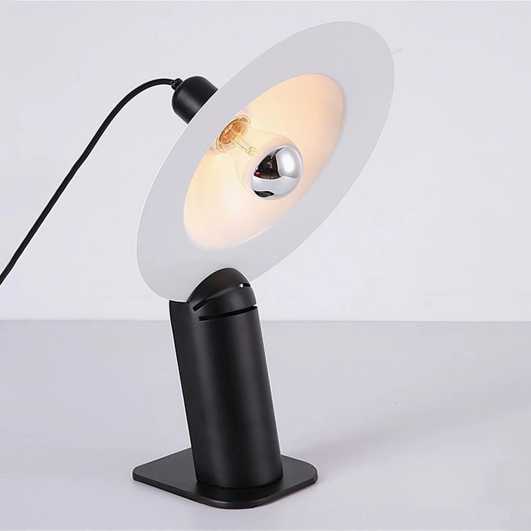 Lampiatta black disc table lamp with matte metal base and adjustable helmet-shaped aluminum shade, front studio view