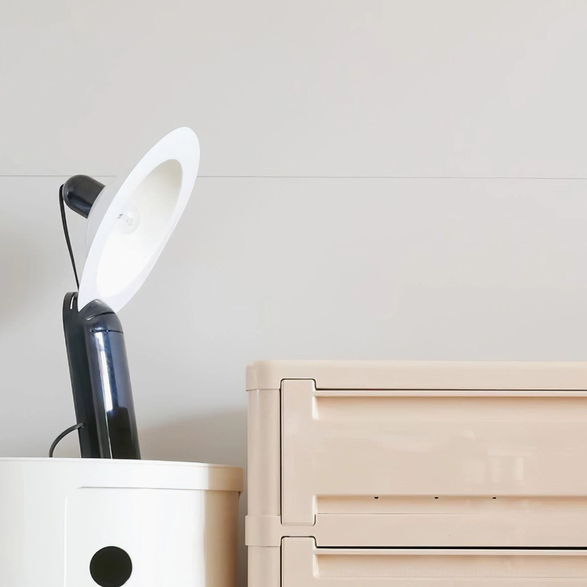 Lampiatta black disc table lamp with precision-engineered components and adaptable light direction for any room