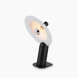 Lampiatta adjustable disc table lamp with matte black metal base and white aluminum shade, front three-quarter view