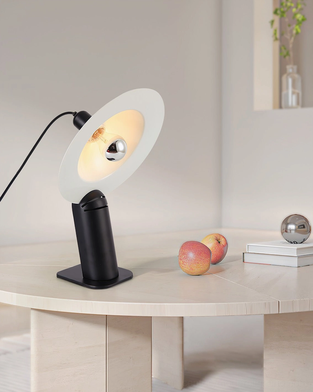 Lampiatta adjustable disc table lamp with functional artistry combining light control with sculptural design elements