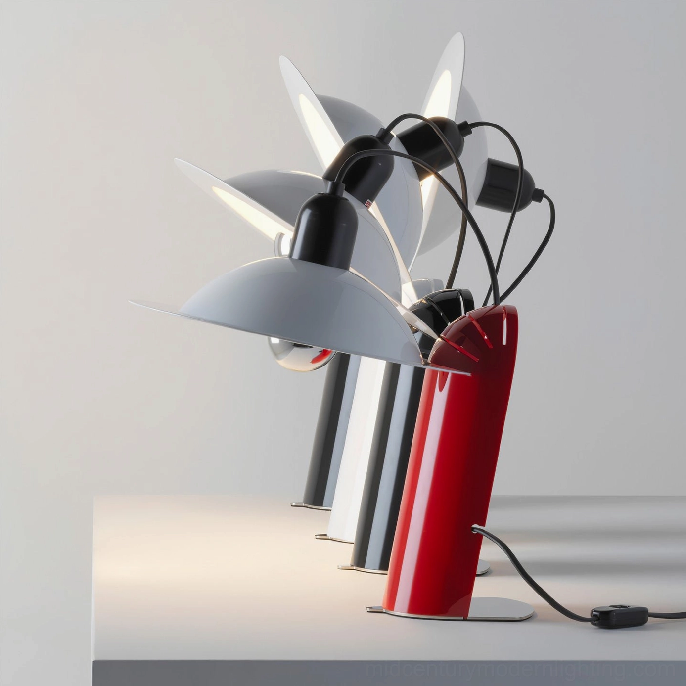 Lampiatta table lamps in all color variants—black, white, and red disc shades—displayed together showcasing color options