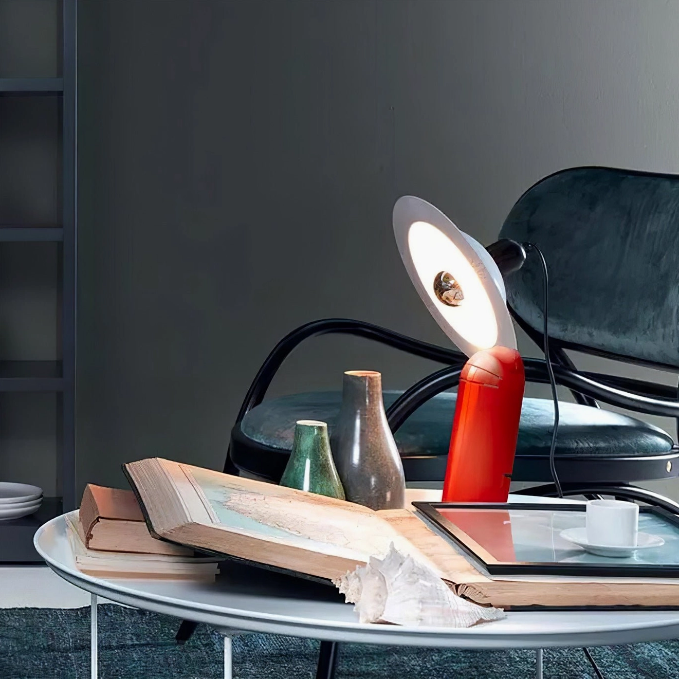 Lampiatta mid-century modern inspired disc table lamp with minimalist metal construction and adjustable light positioning