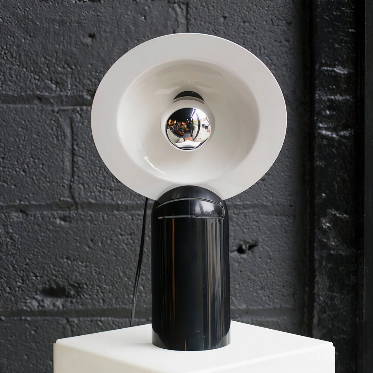 Lampiatta table lamp in red finish showcasing bold contemporary design with adjustable light direction capability