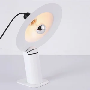 White Lampiatta table lamp with adjustable disc shade and exposed bulb, side profile showing rotational joint mechanism