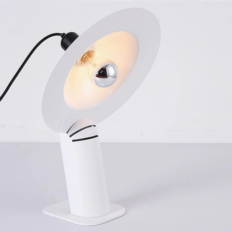 White Lampiatta table lamp with adjustable disc shade and exposed bulb, side profile showing rotational joint mechanism