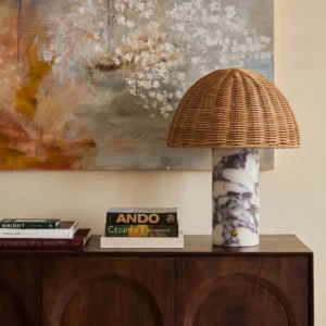 Lance table lamp styled on luxury living room side cabinet with books and wall art - bohemian modern interior design