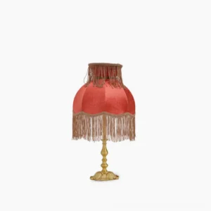 Lanna tassel table lamp front view with burgundy red fabric shade and hand-sewn tassel trim, brass base, studio white background