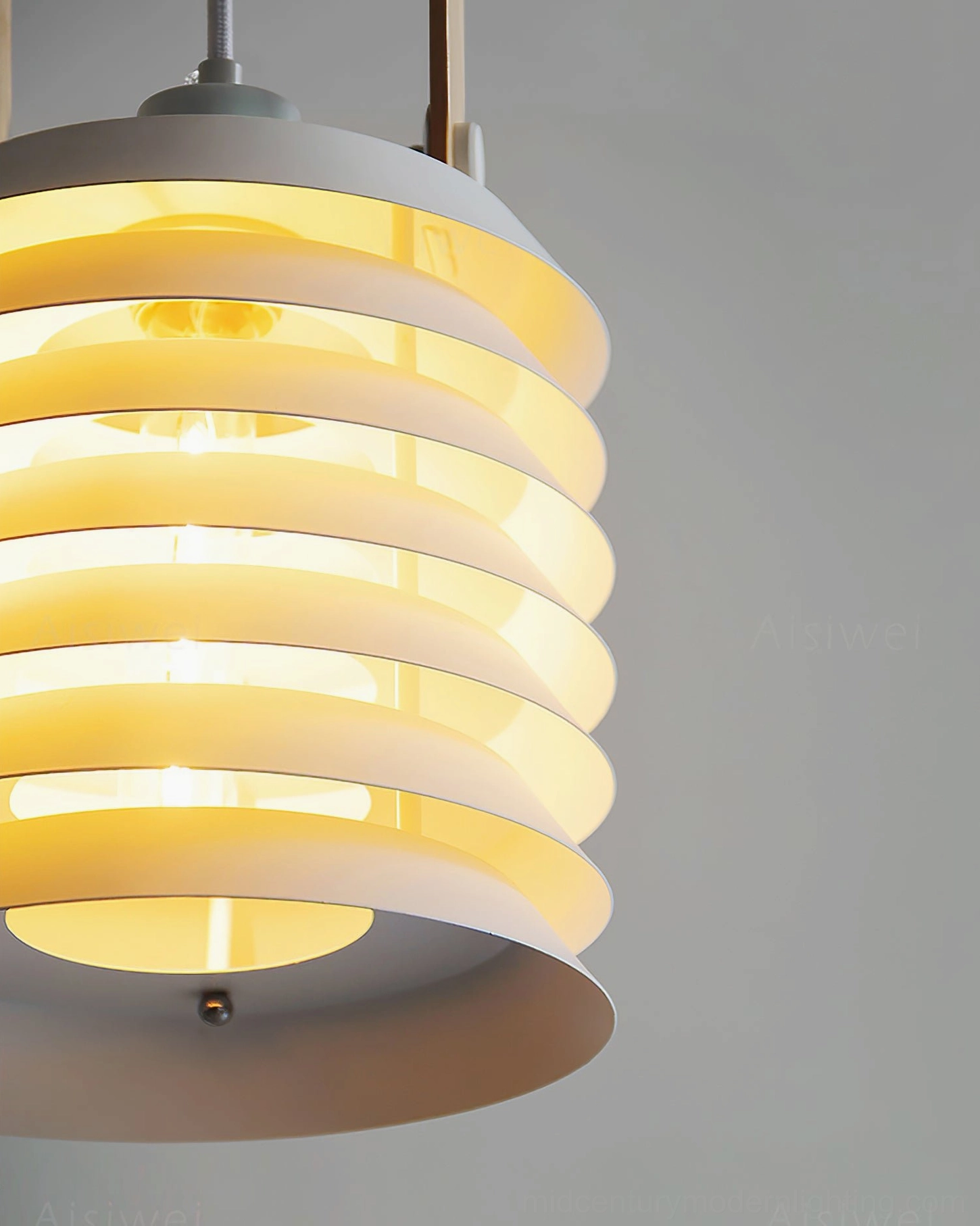 Tiered lantern pendant lamp side view showing layered metal disc honeycomb structure