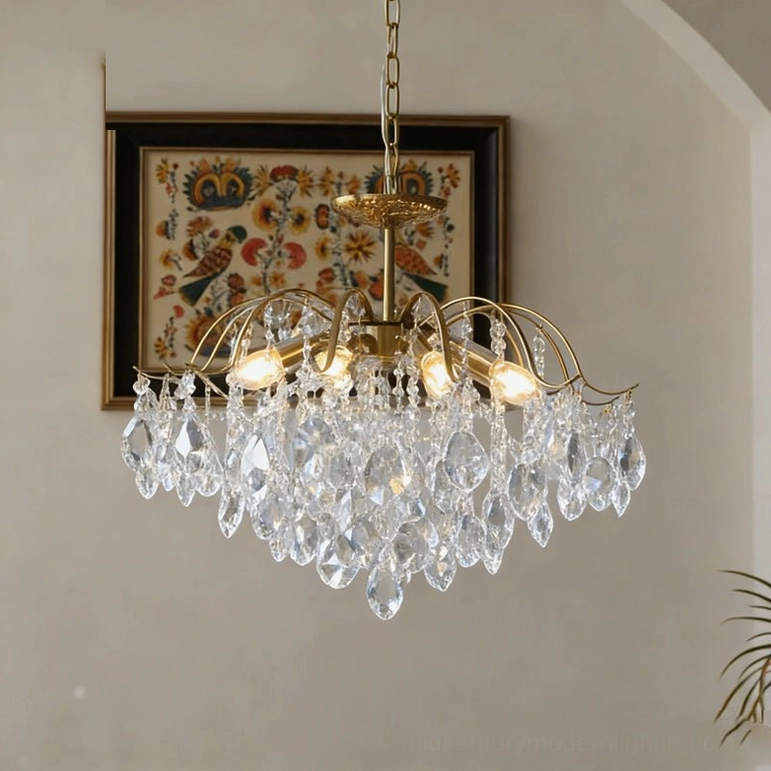 Large clear crystal waterfall chandelier with extended brass arms and abundant crystal pendants for statement rooms