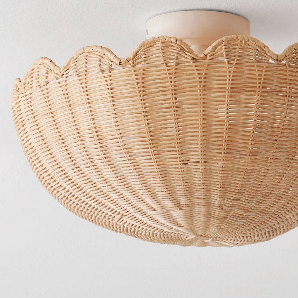 Large diameter handwoven raffia ceiling light showing detailed construction and matte white metal base on plain background