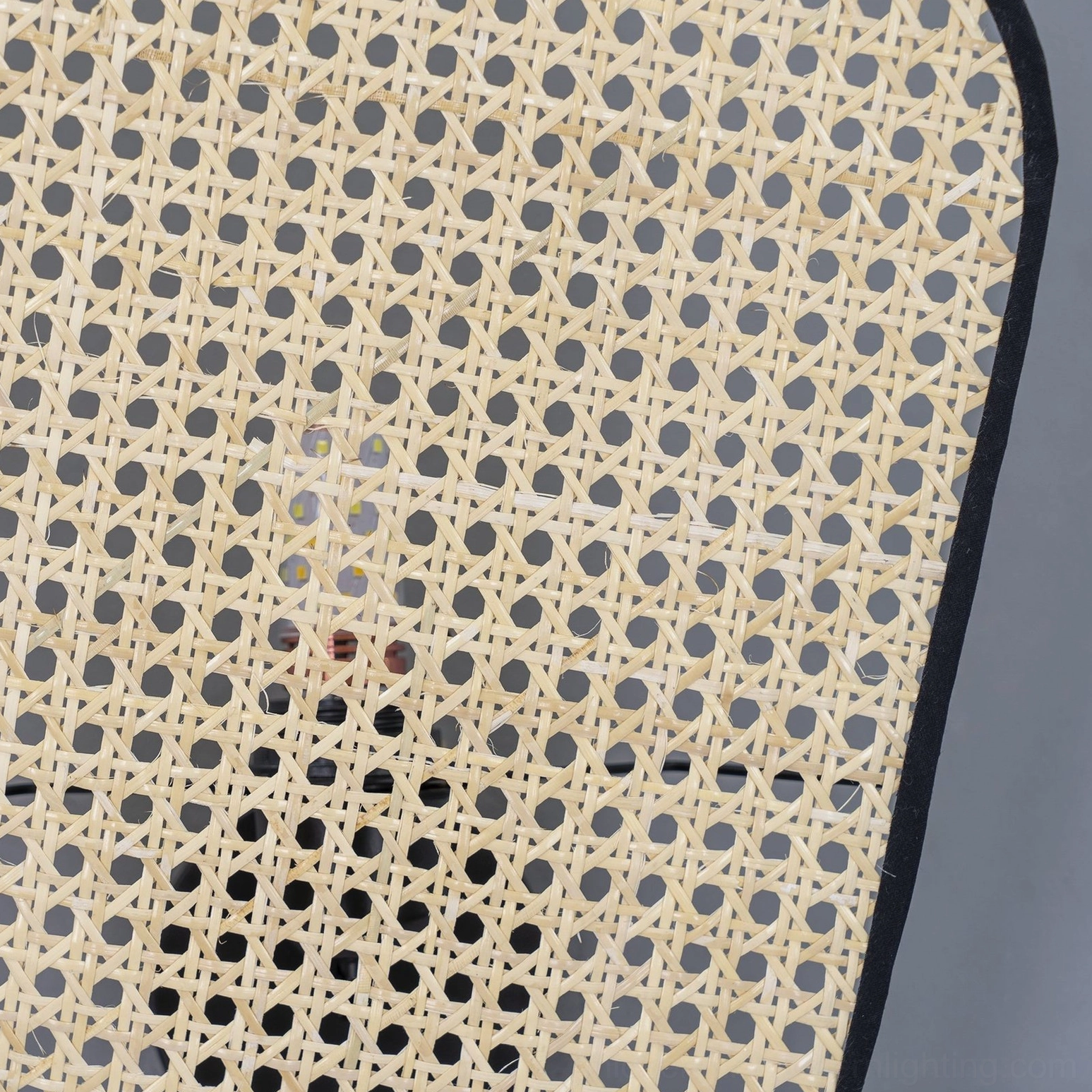 Large scale dual-panel rattan cannage wall lamp full room view modern living space installation