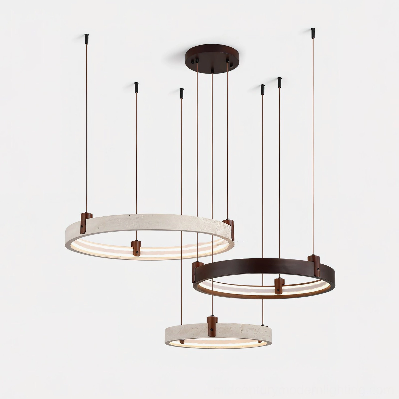 Large three-head travertine chandelier with varying ring diameters in contemporary ceiling installation