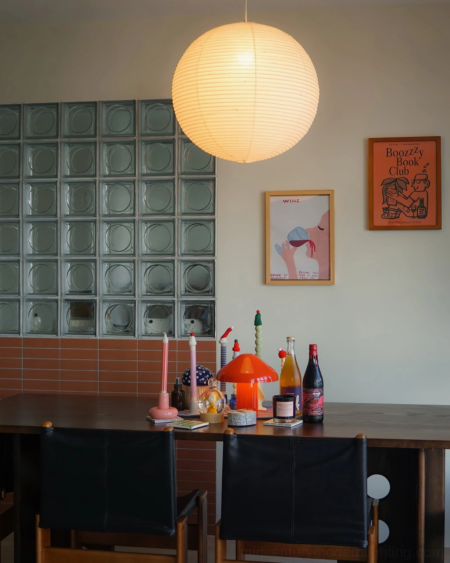 Large white washi paper sphere pendant lamp in modern residential interior with natural lighting