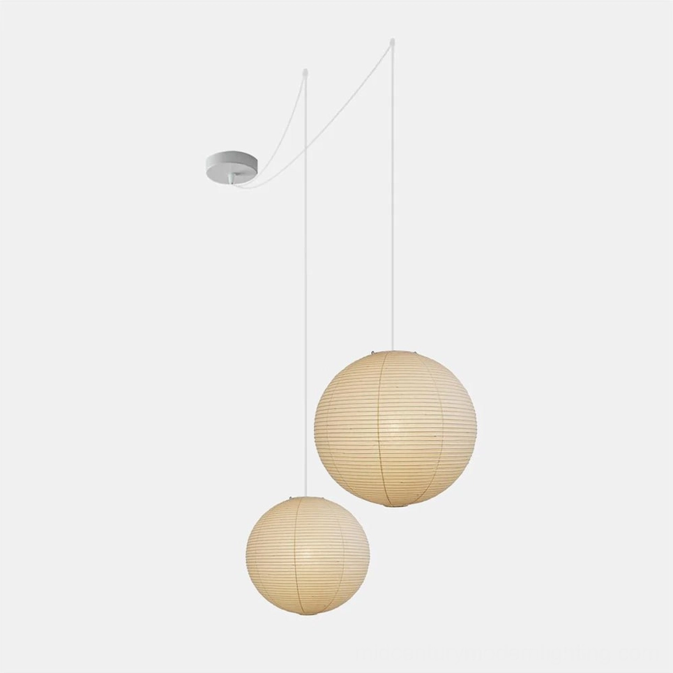 Large white washi paper sphere pendant lamp as statement piece in contemporary space