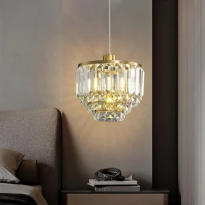 Tiered crystal brass pendant illuminated in bedroom bedside corner warm glow mid-century modern