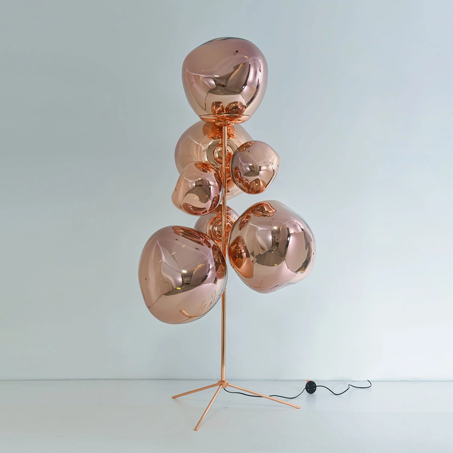 Contemporary lava cone floor lamp showing all available metallic finish variations displayed