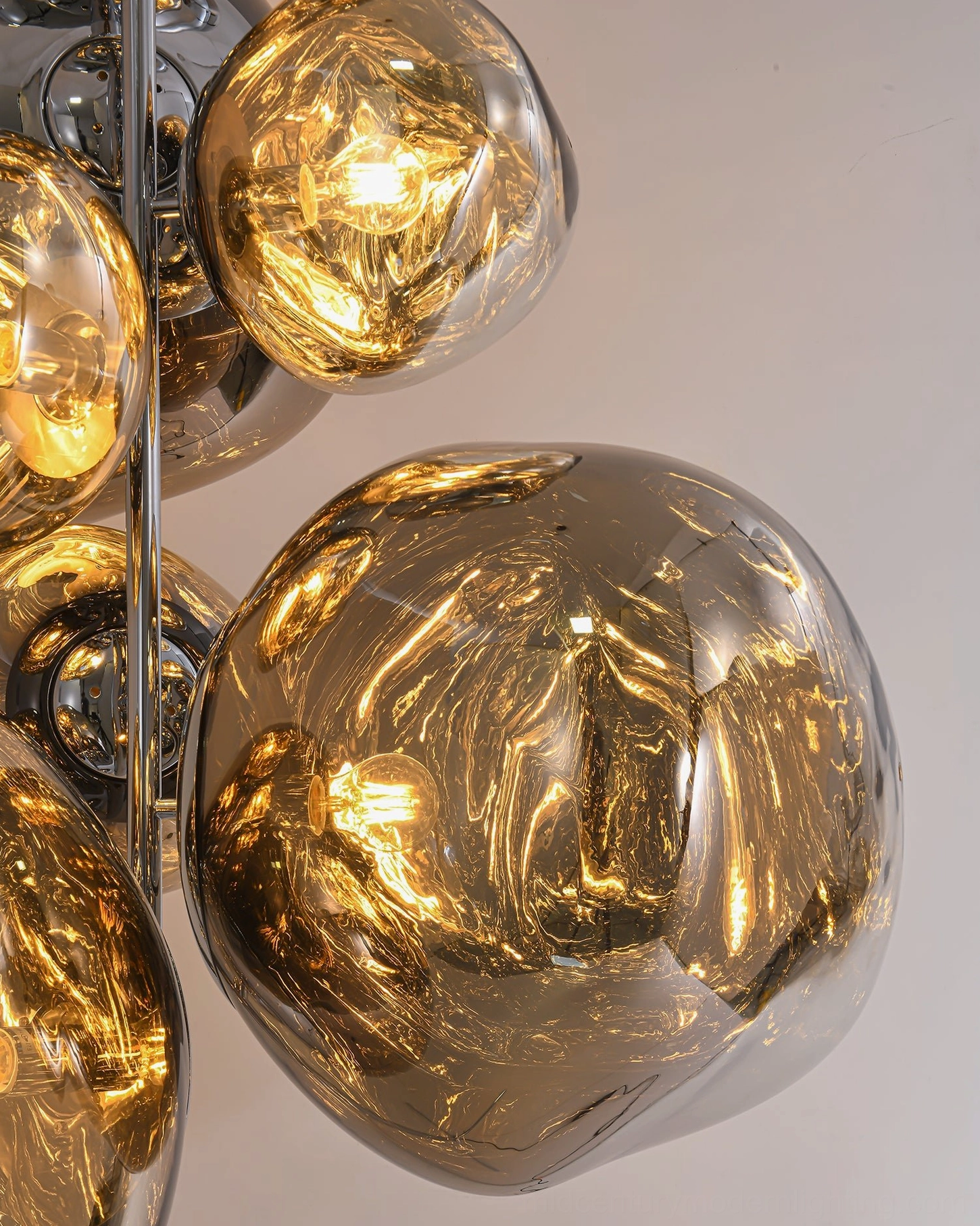 Amber tinted lava cone lamp glass globes detail showing fluid marble-like texture with warm light