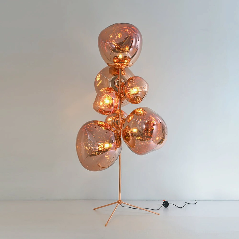 Rose gold finish lava cone floor lamp detail showing metallic sheen and molten glass texture