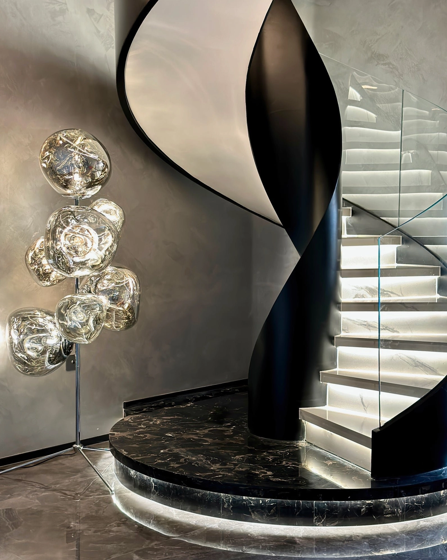 Lava cone sculptural floor lamp showing organic molten glass cone design from side angle