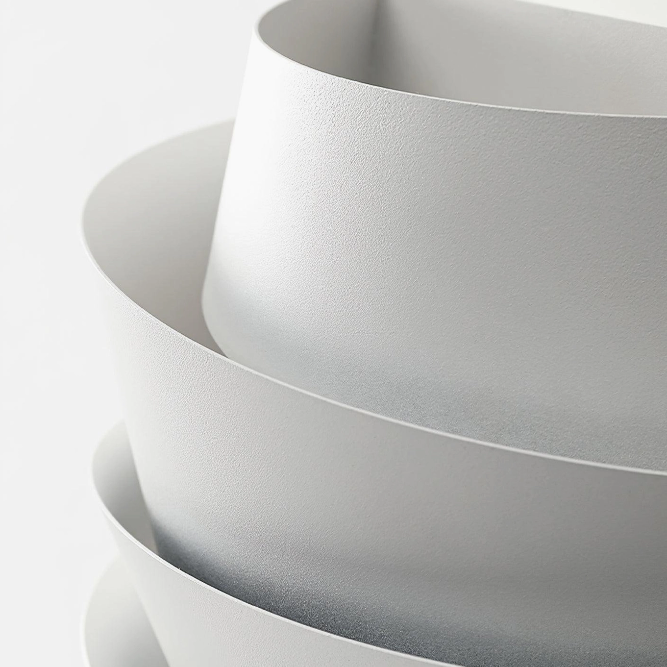 Close-up detail of Le Soleil wall lamp frosted matte texture with curved tiered structure