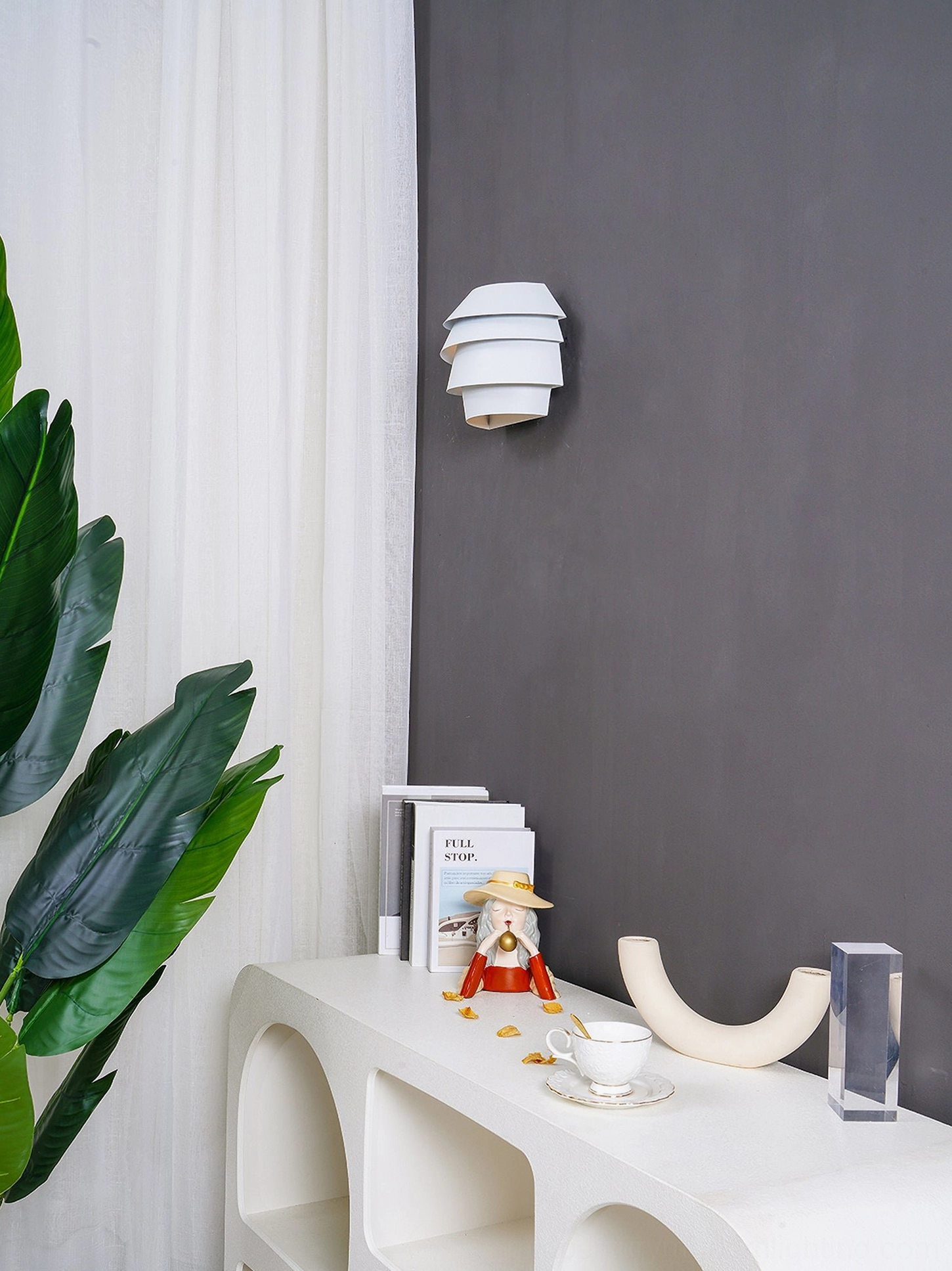 Le Soleil modern sconce layered design showing geometric light distribution
