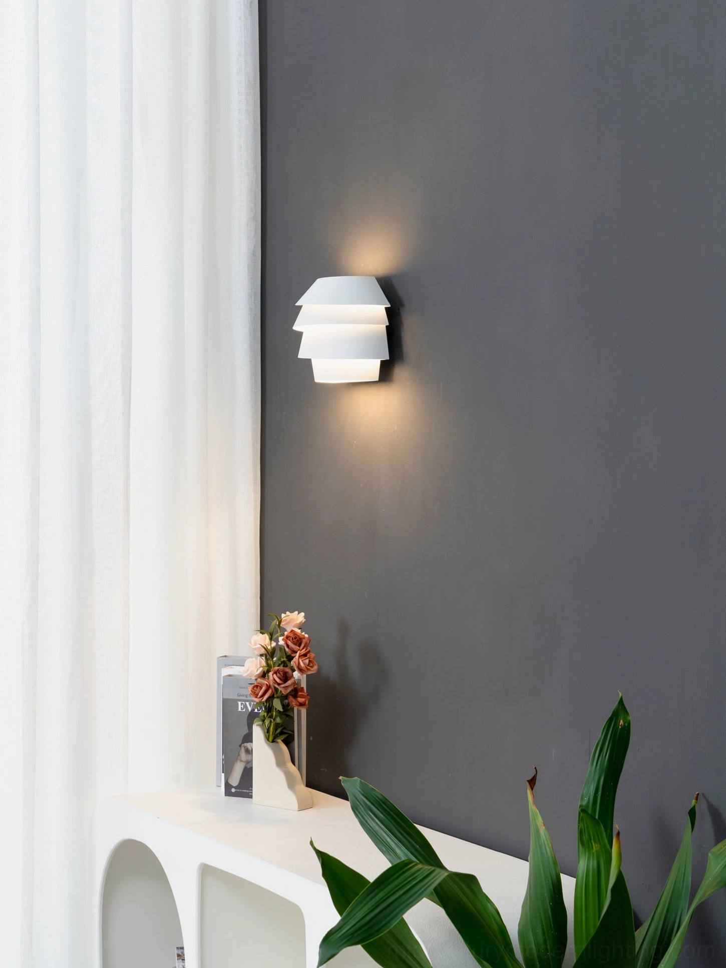 Le Soleil modern wall sconce showing asymmetrical banding light diffusion effect