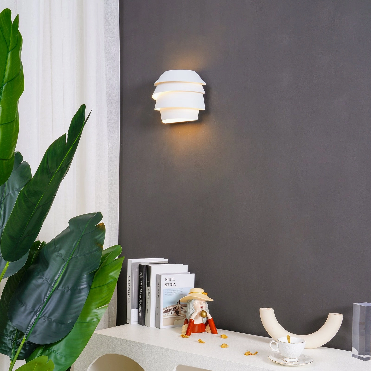 Le Soleil wall-mounted sconce showing organic layered form and light filtering