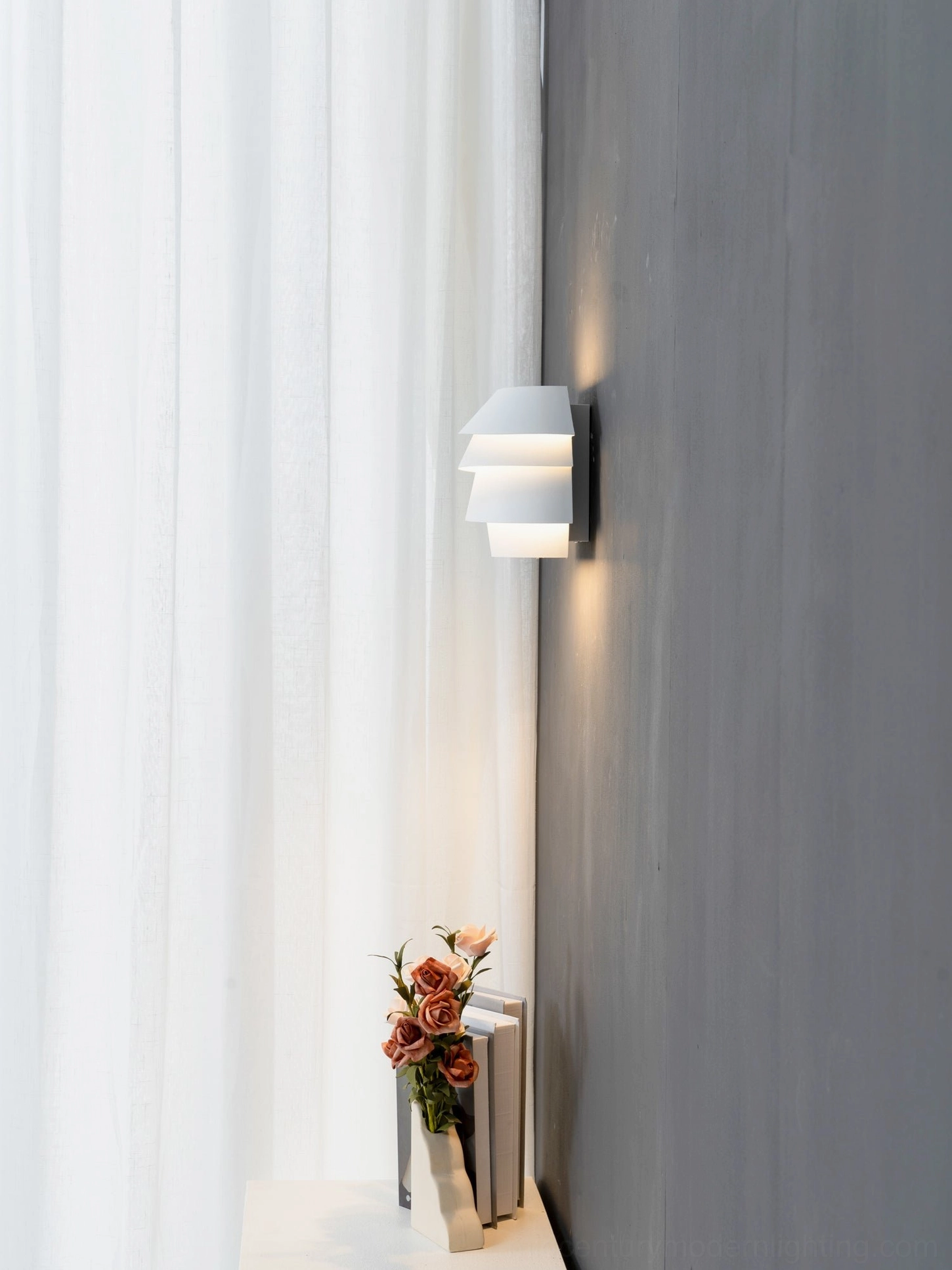 Le Soleil white tiered wall lamp with precision-engineered layered structure