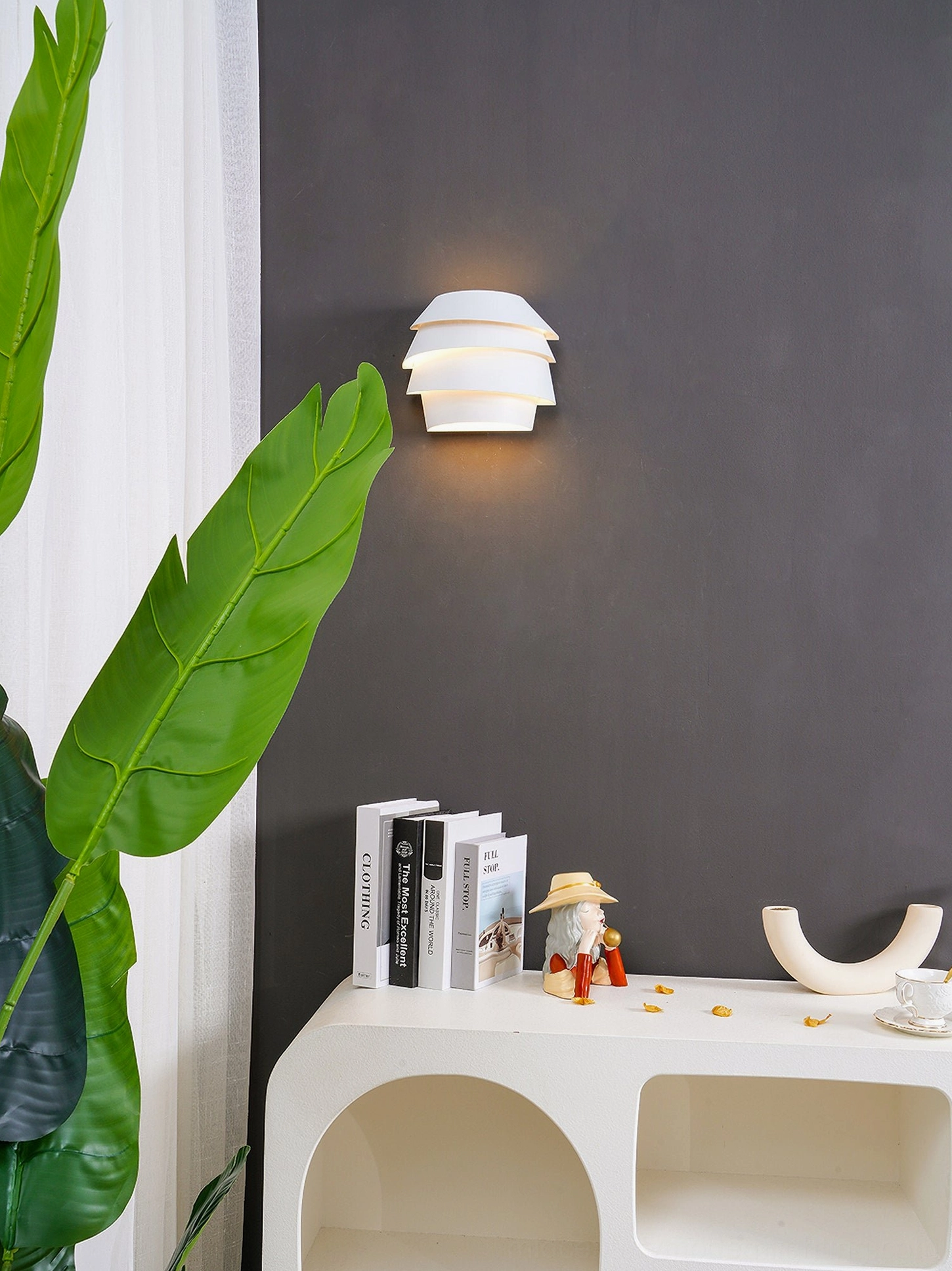 Le Soleil wall-mounted sconce with staggered bowl shape showing shadow play effect
