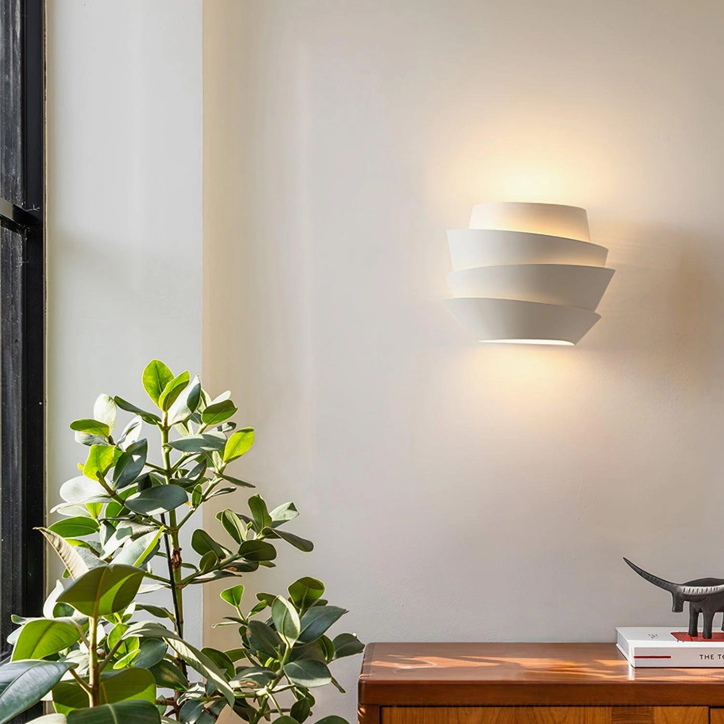 Le Soleil modern sconce in living room corner with warm ambient lighting and plant decor