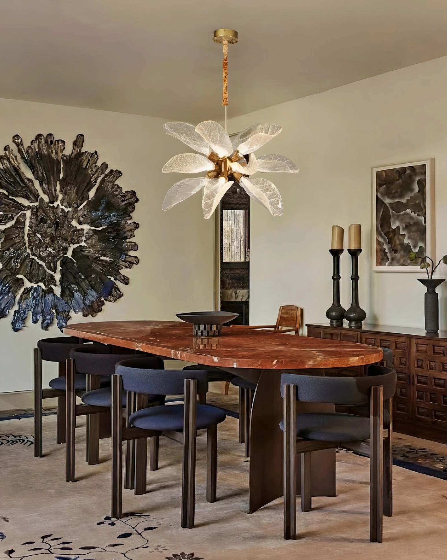 Leaf bloom brass chandelier installed in luxury dining room above wooden table