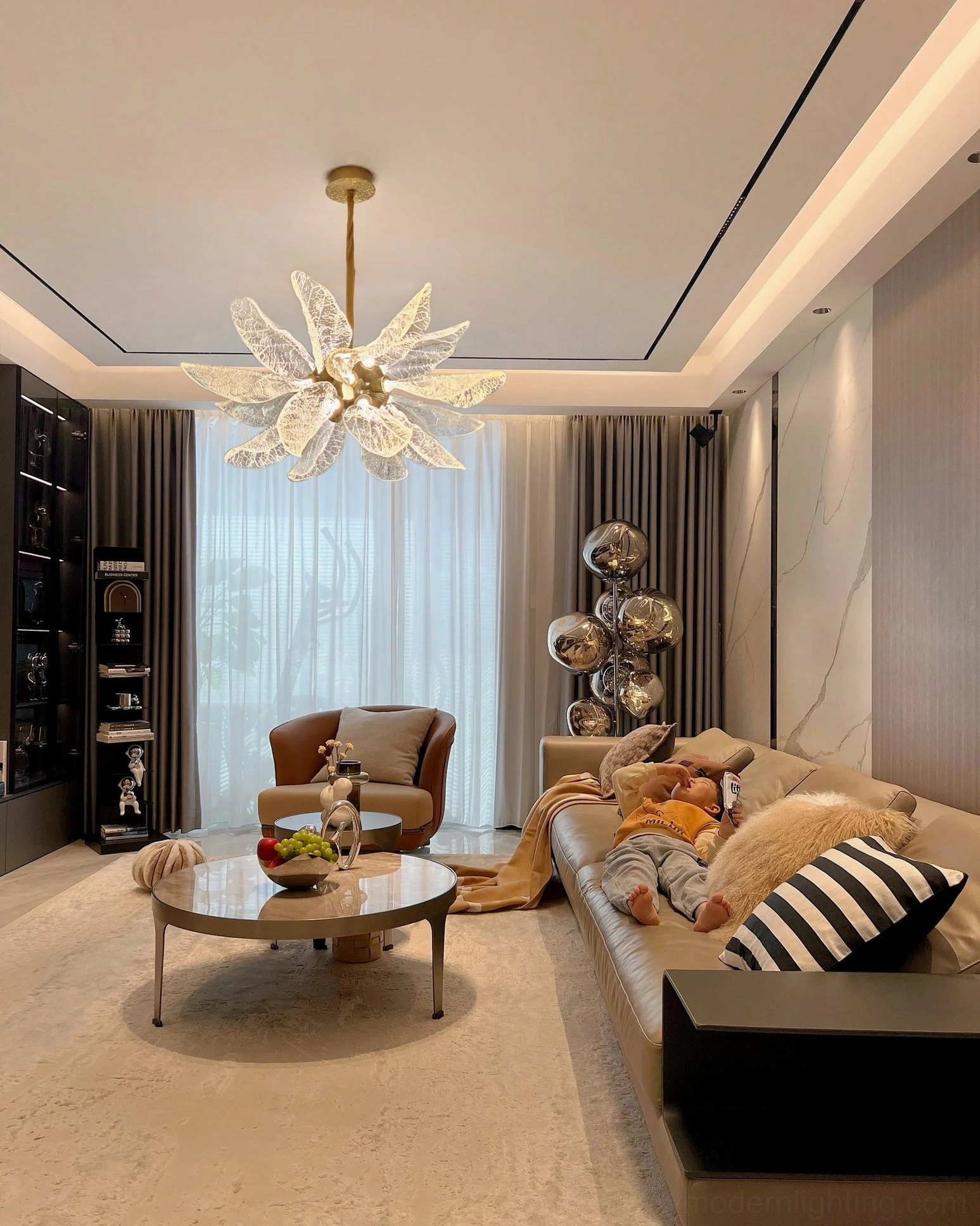 Leaf bloom brass chandelier in contemporary luxury living room cozy atmosphere