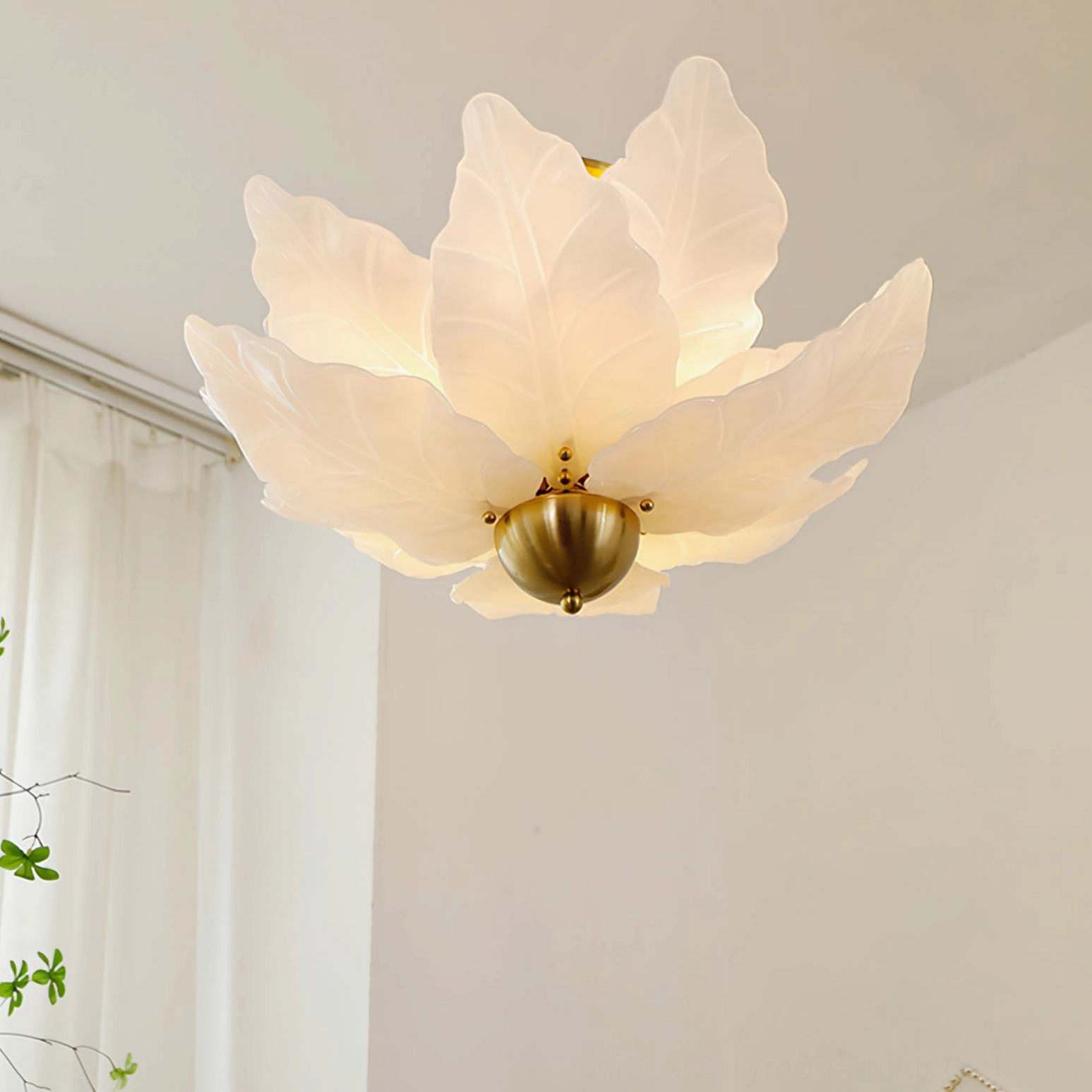 Close-up detail of leaf-shaped glass petal ceiling lamp showing frosted glass texture and brass hardware craftsmanship