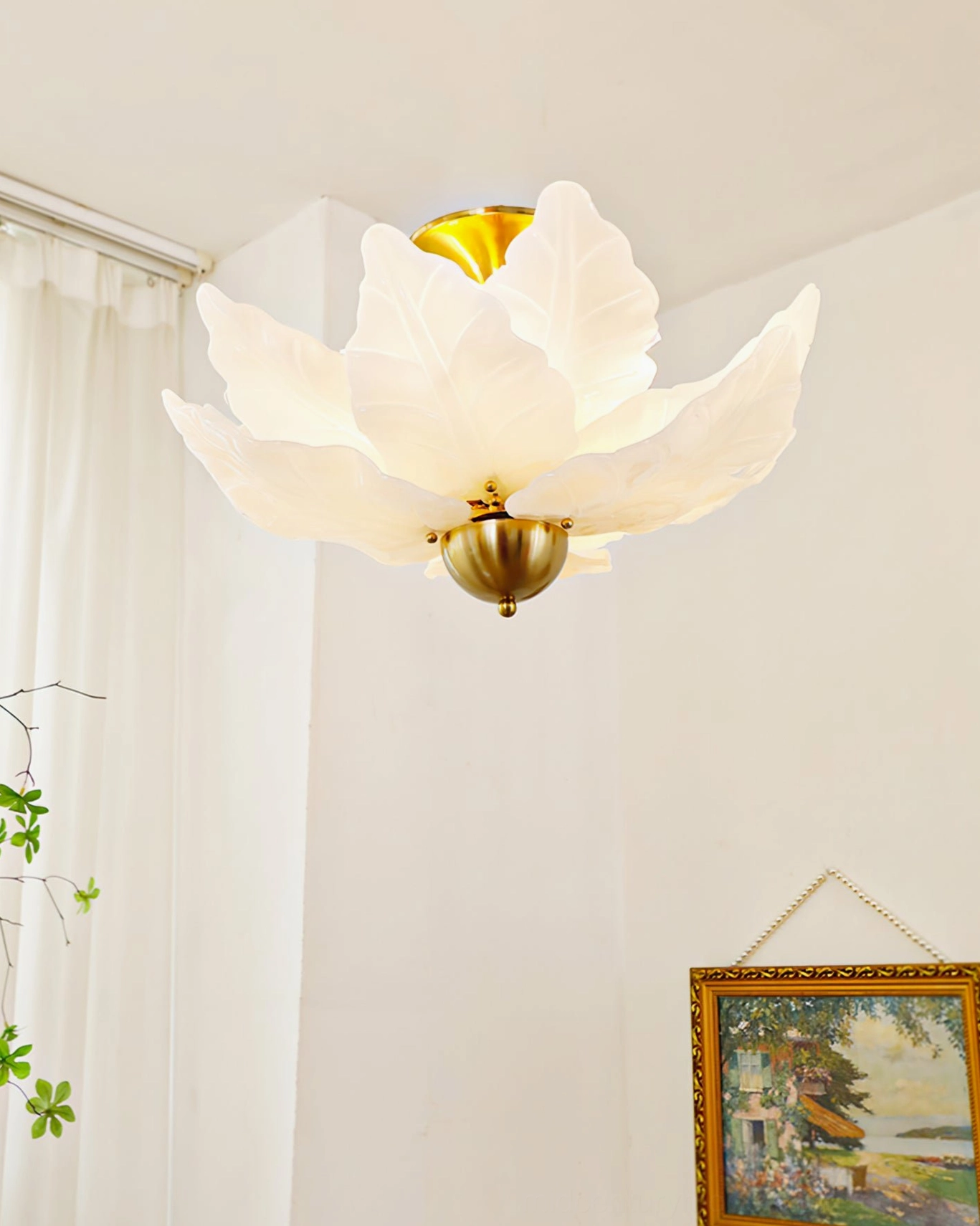 Leaf petal ceiling mount light side profile showing elegant off-white frosted glass with vintage landscape framed art background