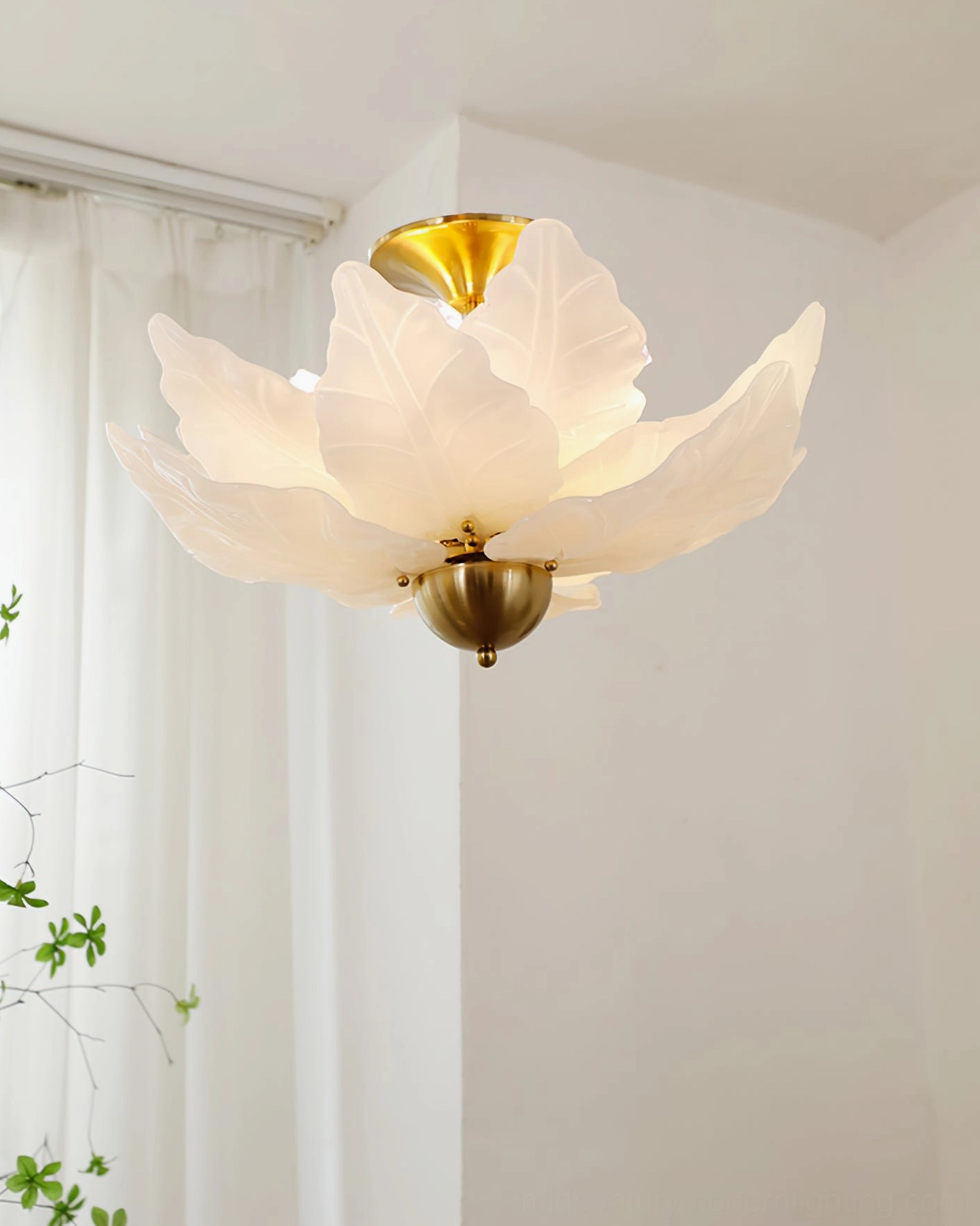 French romantic leaf glass ceiling light in minimalist white space with sheer curtain and climbing vine accents