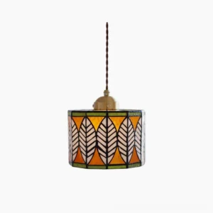 Botanical leaf Tiffany stained glass pendant lamp with brass fixture, front view on white background