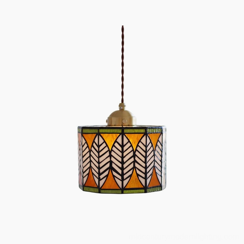 Botanical leaf Tiffany stained glass pendant lamp with brass fixture, front view on white background
