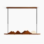 Leah Mountains linear pendant light – full front view of 47-inch walnut and black metal mountain ridge chandelier with frosted acrylic hemisphere