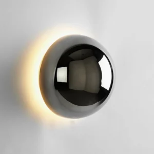 Adjustable LED wall sconce with warm backlit illumination demonstrating ambient halo effect