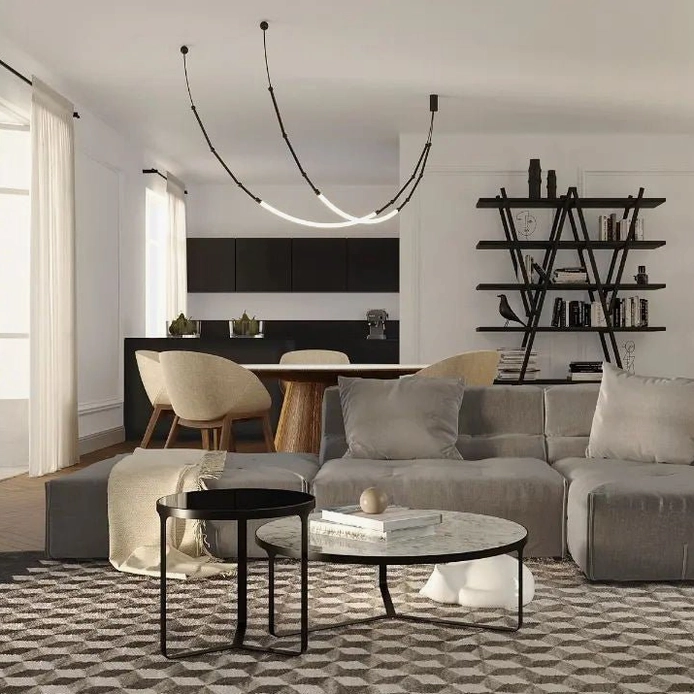 Linear Leda curved chandelier illuminating modern open-plan living and dining room with luxury minimalist decor