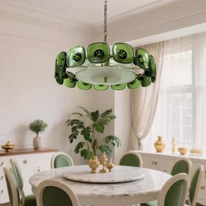 Lennox green glass ring chandelier installed above marble dining table French interior design