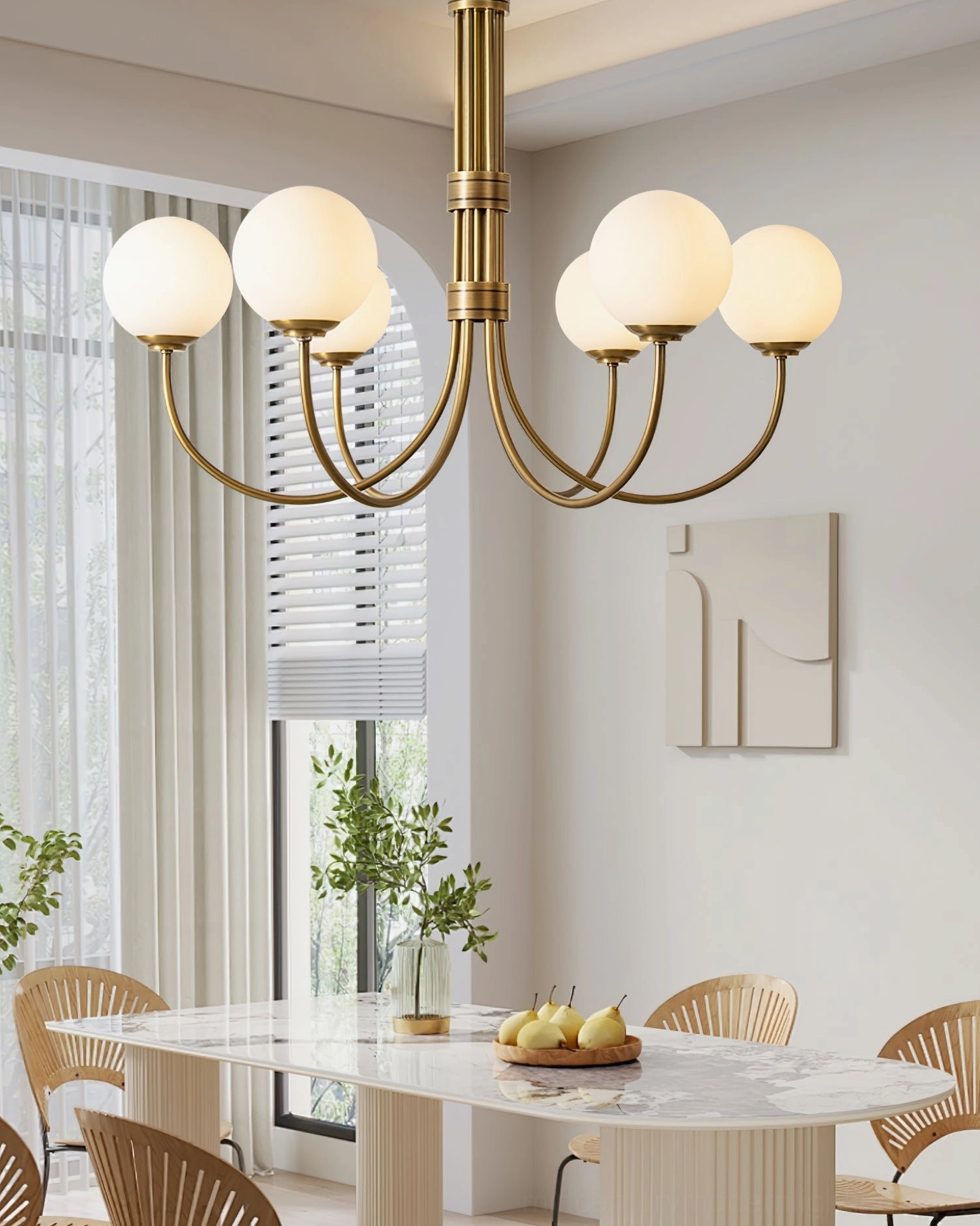 Eight-light brass chandelier suspended in bright minimalist dining space with neutral decor, modern mid-century fixture installation