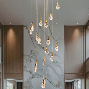 Leo Bubble Chandelier installed in luxury double-height living room with marble wall and warm ambient lighting