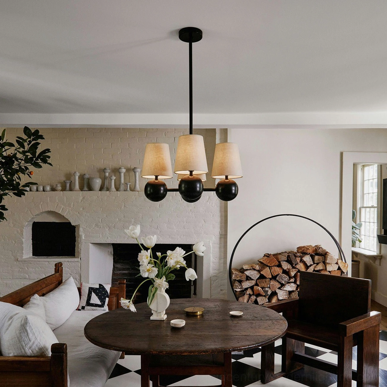 Leoda 4-light chandelier in farmhouse dining setting with neutral décor and table accents