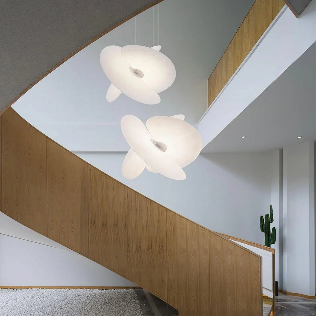 Levante silk pendant light glowing, ethereal warm illumination through overlapping sculptural panels