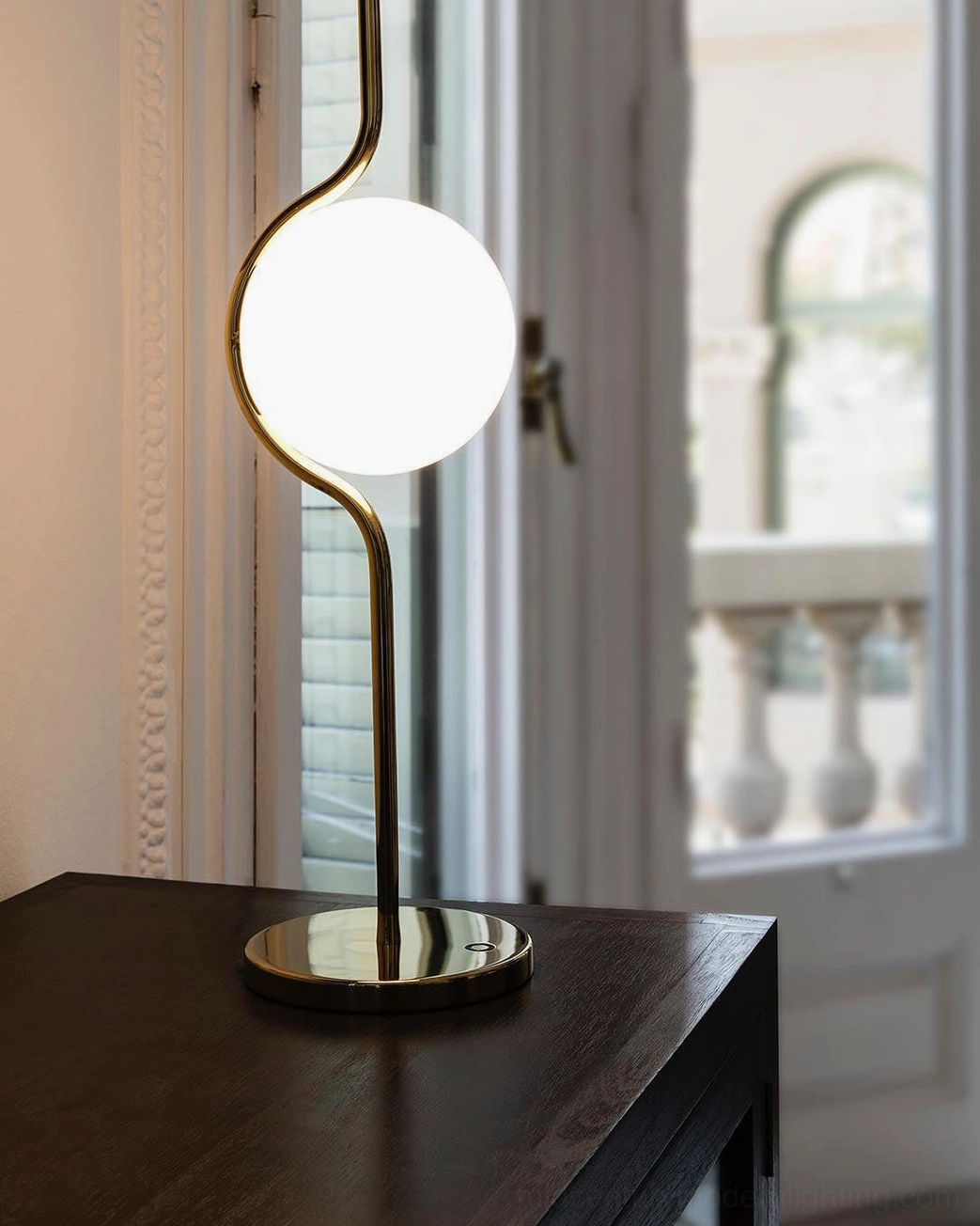 Levita mid-century modern table lamp detailed view showing polished gold metal construction and frosted glass diffuser