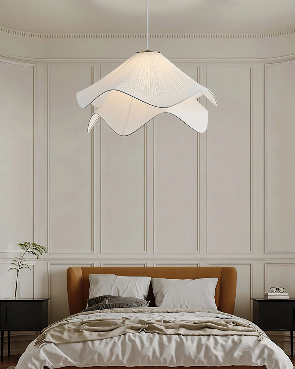 Minimalist Lia pendant light suspended from brass hardware, highlighting clean lines and organic pleated fabric form in modern interior